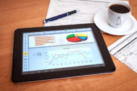 tablet with excel spreadsheet showing charts